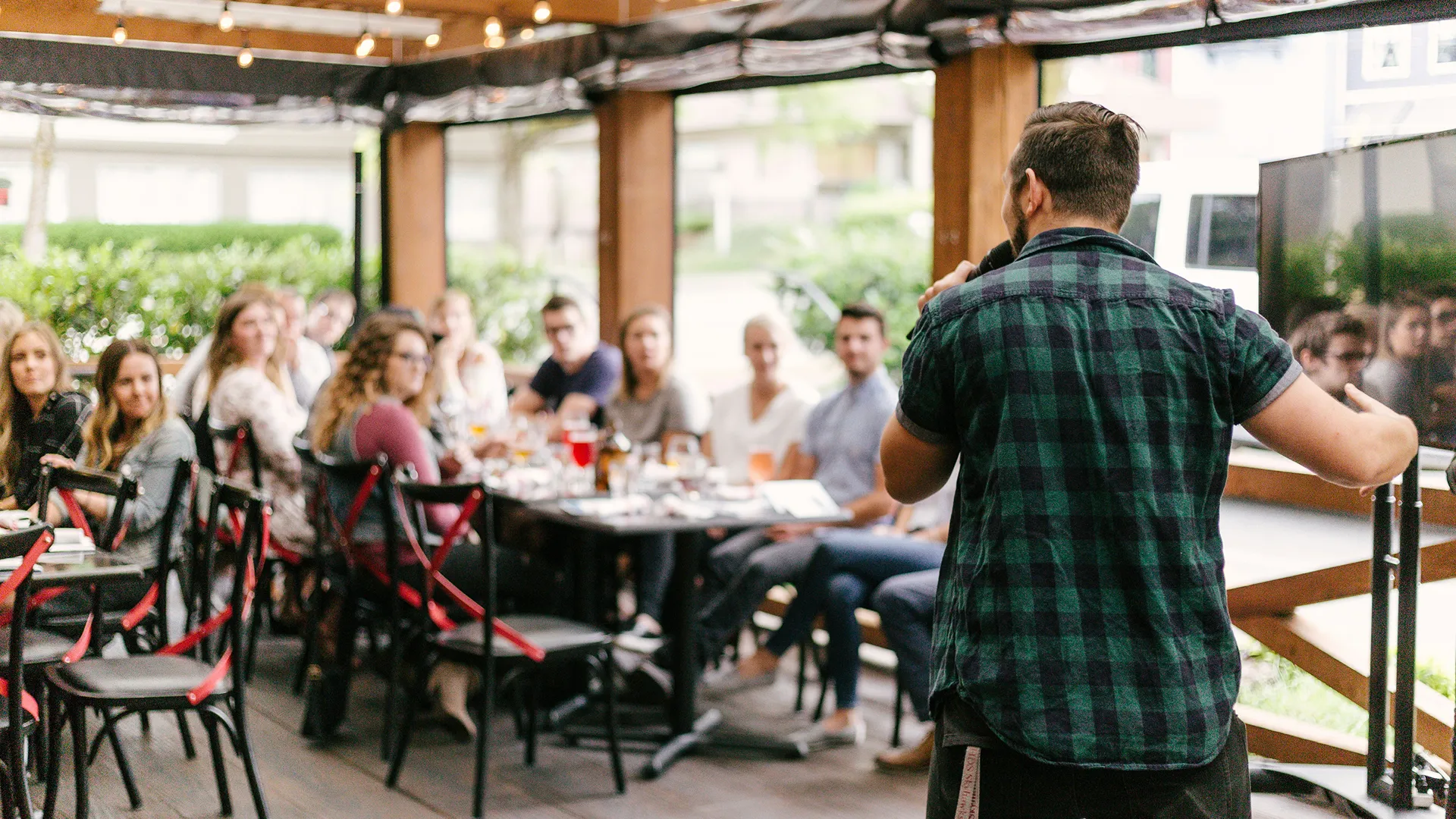 Man-Giving-Presentation-On-Outdoor-Patio